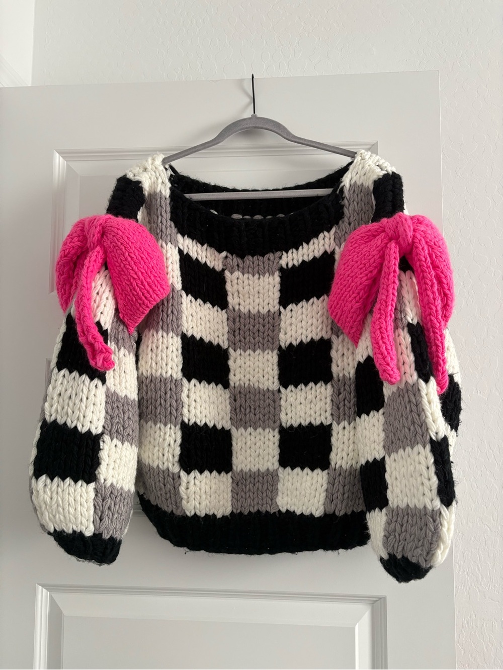 Chunky Black & White Checker Sweater with Pink Bow Accents